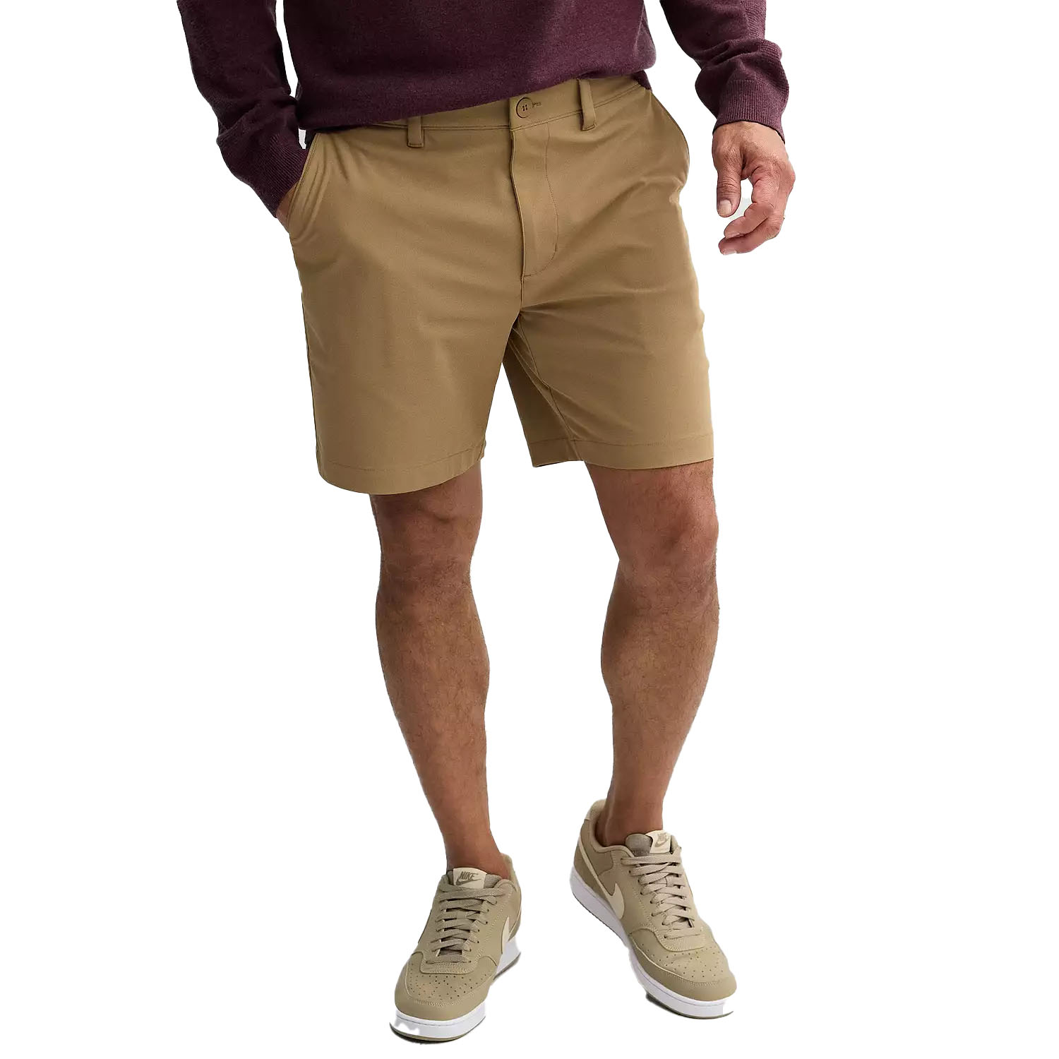 Tan FLX Premium Hybrid Shorts with a straight fit, featuring belt loops, a zip and button closure, and side pockets, paired with casual beige sneakers and a maroon sweater.