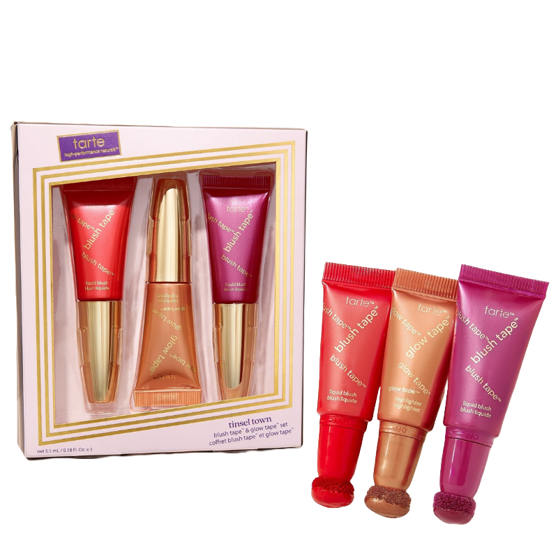 Tarte Cosmetics' Tinsel Town set includes three tubes: two Blush Tape liquid blushes in red and purple, and one Glow Tape highlighter in gold. Each tube features an applicator tip for easy application.