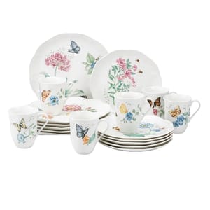 A Lenox Butterfly Meadow 18-piece dinnerware set featuring plates, cups, and saucers with floral and butterfly designs in pastel colors.