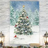 A painting of a Christmas tree adorned with a star and surrounded by snow, featuring red cardinals. Flanked by two lit lanterns on a white stone-textured wall with snowy garland and pinecones below.