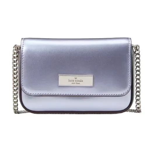 A metallic silver Kate Spade New York crossbody bag with a chain strap and logo plaque on the front.