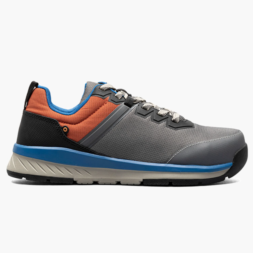 A stylish sneaker featuring a grey mesh upper with orange and black accents, blue detailing around the collar, and a grey and black sole.