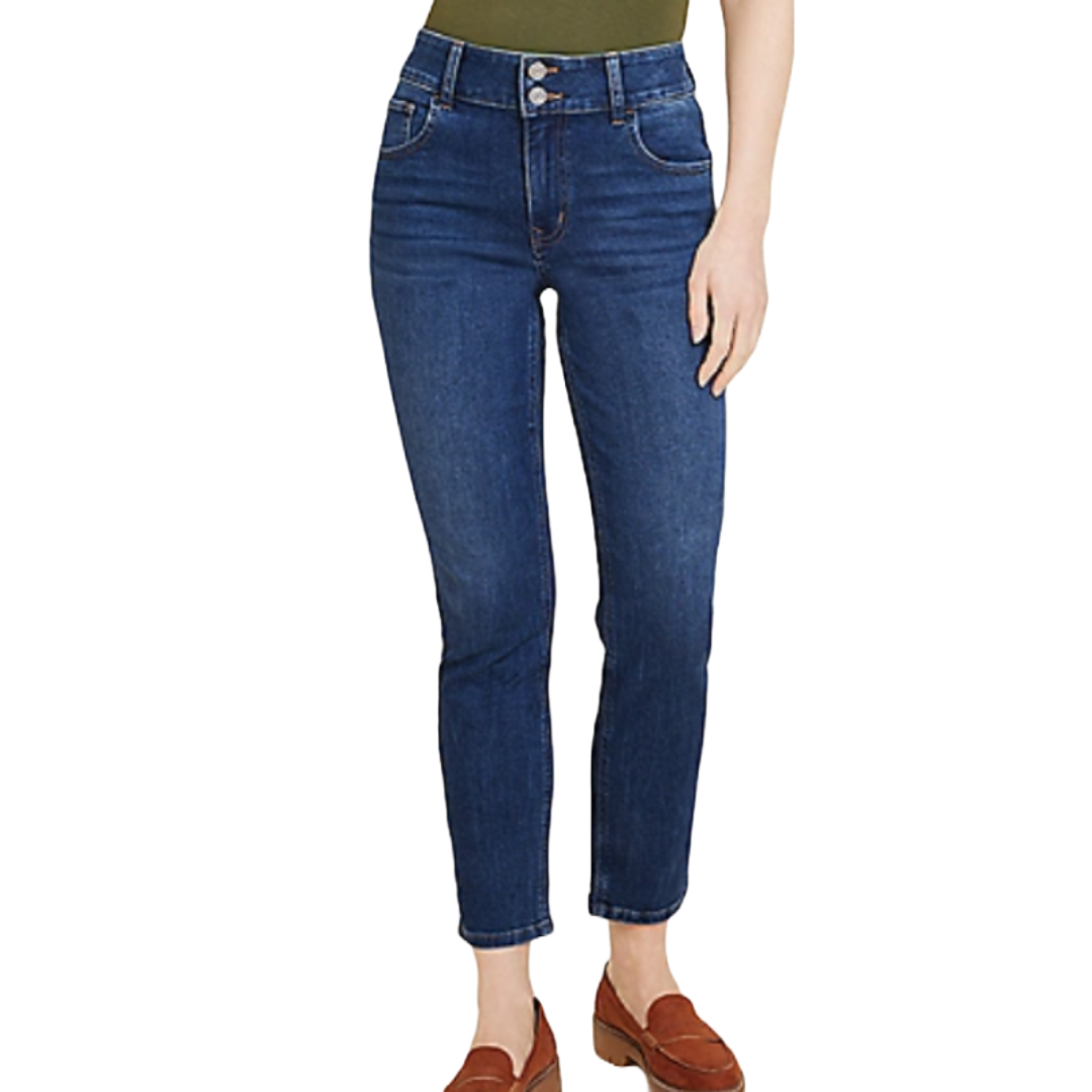 Dark mid-rise slim straight ankle jeans, styled with three front buttons, classic five-pocket design, and rolled cuffs; paired with brown loafers and an olive top.