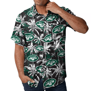 A New York Jets-themed button-up shirt featuring a tropical design with palm trees and the team's logo in green and white. The short-sleeve shirt combines a sporty look with a casual, vacation-like feel.