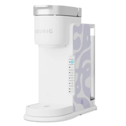 A white Keurig coffee maker featuring a light purple abstract pattern on the side, with controls for cup sizes and strength settings.