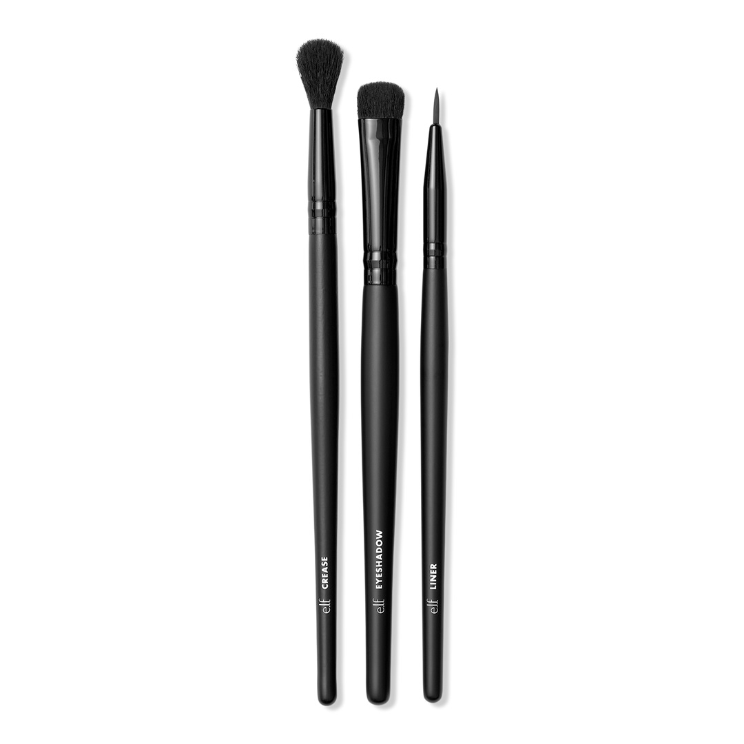 A set of three black makeup brushes labeled for crease, eyeshadow, and liner application.