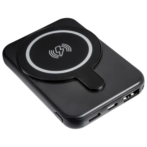 A black portable wireless charger with a circular charging symbol, featuring USB ports on the side for wired connections.