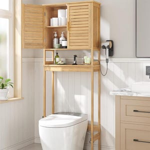 Wooden bathroom over-the-toilet storage cabinet with louvered doors and an open shelf, next to a modern toilet.