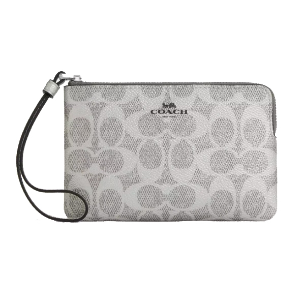 A Coach wristlet with a zip closure featuring the brand's signature 'C' pattern and a detachable strap.
