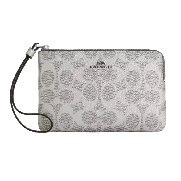 A Coach wristlet with a zip closure featuring the brand's signature 'C' pattern and a detachable strap.