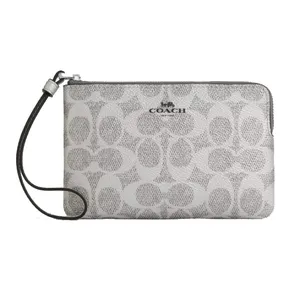 A Coach wristlet with a zip closure featuring the brand's signature 'C' pattern and a detachable strap.