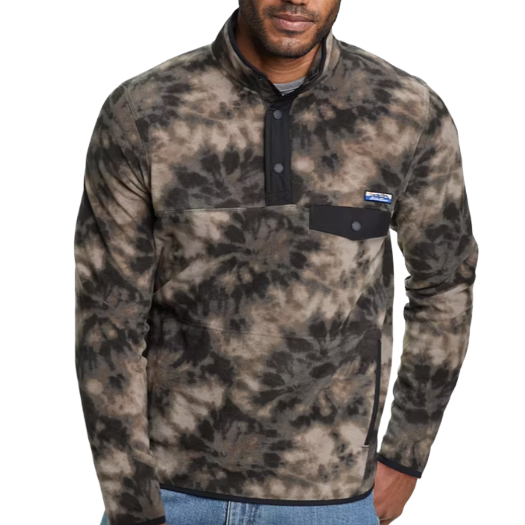 A man is wearing a tie-dye patterned fleece pullover with a high collar and button placket, featuring a chest pocket with a logo patch.