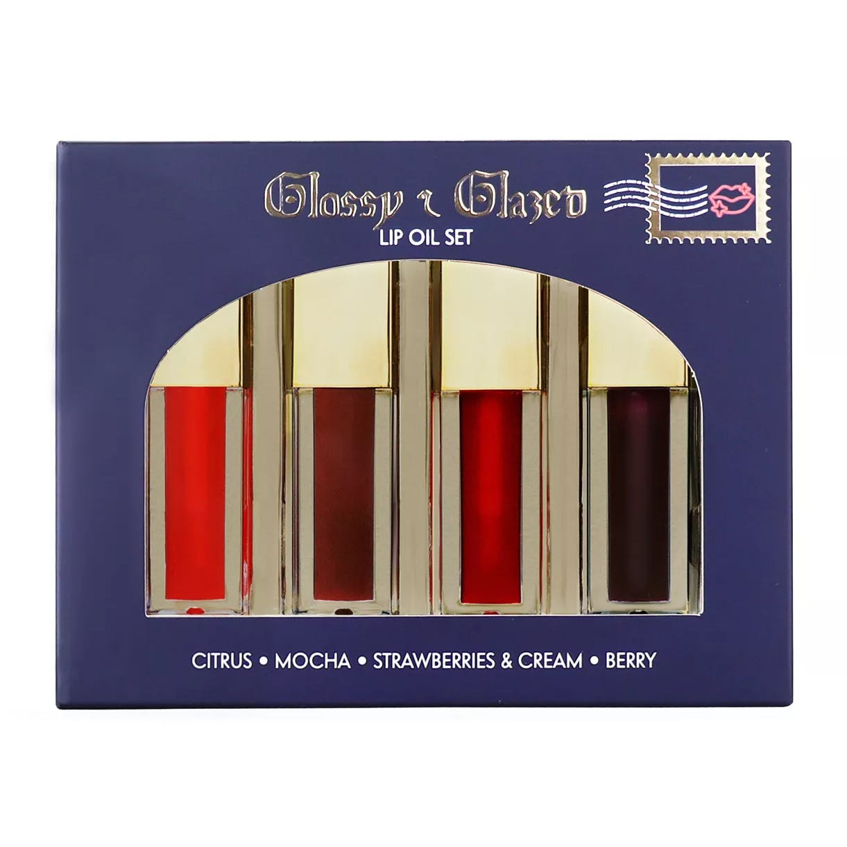 Glossy & Glazed Lip Oil Set includes four shades: Citrus, Mocha, Strawberries & Cream, and Berry, packaged in a sleek box.