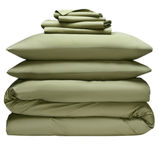 A stack of green bedding set includes two pillows, a duvet, and folded sheets.