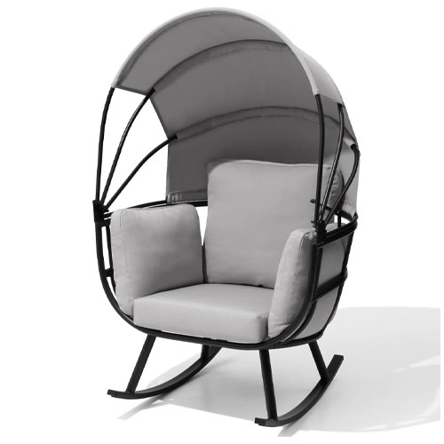 A cushioned rocking chair with a canopy, black metal frame, and light gray upholstery, designed for comfortable outdoor lounging.