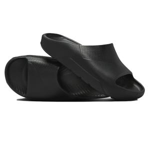 A pair of black slide sandals with a sleek design and small perforations for breathability. They have a contoured shape with open toes and a textured footbed for comfort.