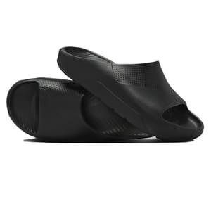 A pair of black slide sandals with a sleek design and small perforations for breathability. They have a contoured shape with open toes and a textured footbed for comfort.