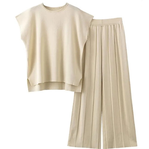 A cream-colored sleeveless top paired with matching wide-leg pleated trousers, featuring a clean and simple design.