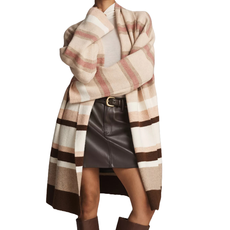 A long, open-front cardigan with wide horizontal stripes in beige, pink, white, and brown tones, paired with a dark leather mini skirt and a white top, creating a stylish layered look.