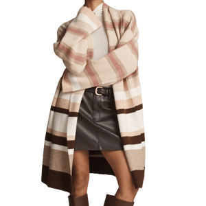 A long, open-front cardigan with wide horizontal stripes in beige, pink, white, and brown tones, paired with a dark leather mini skirt and a white top, creating a stylish layered look.