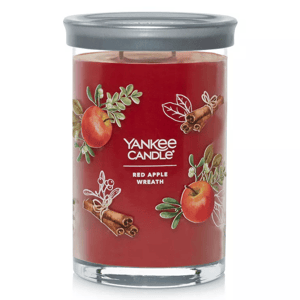 Yankee Candle Red Apple Wreath, featuring a cinnamon and apple scent in a red candle jar with a silver lid.