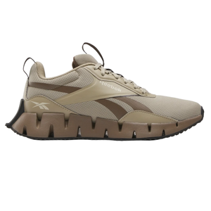 Reebok Zig Dynamica STR Shoes in beige with a distinctive zigzag midsole design, featuring a mesh upper for breathability and a sleek, modern look suitable for casual or sporty wear.