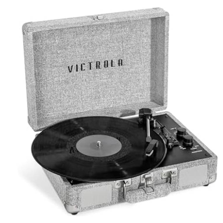 Victrola vintage suitcase-style turntable in a textured gray finish with a classic black vinyl record playing and prominent Bluetooth speaker controls.