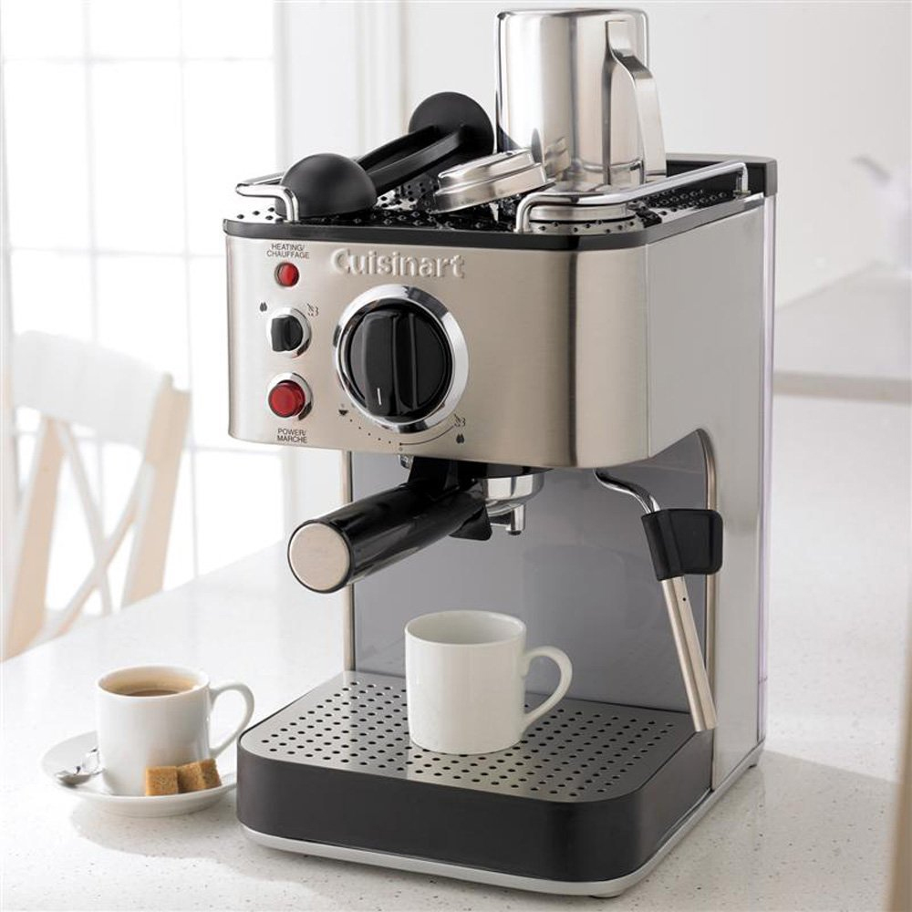 A Cuisinart espresso machine with two cups, one filled with coffee.