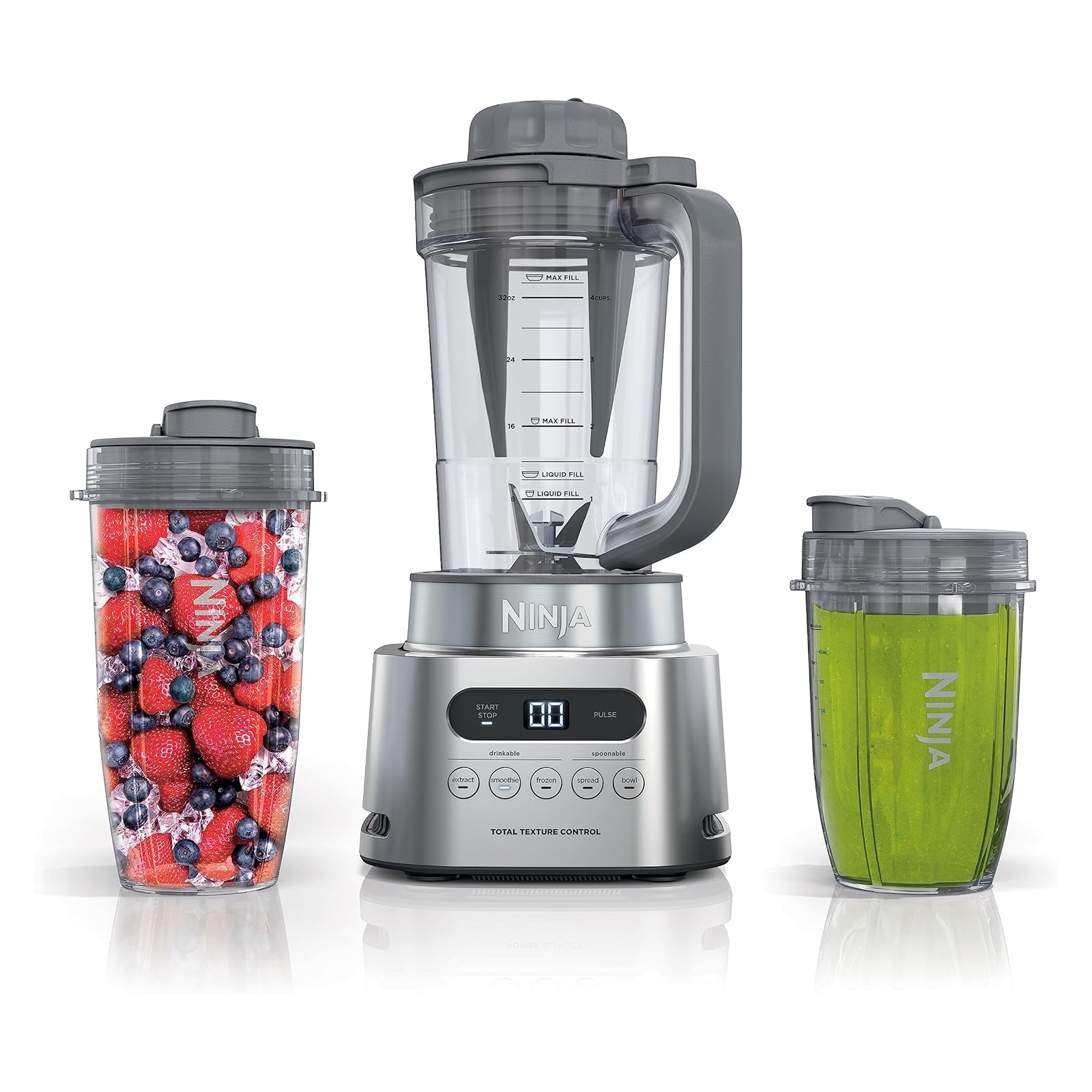 The Ninja Twisti Blender features a sleek base with touch controls and a large blending pitcher. It is accompanied by two personal-sized travel cups with lids, one filled with mixed berries and the other with a green smoothie.