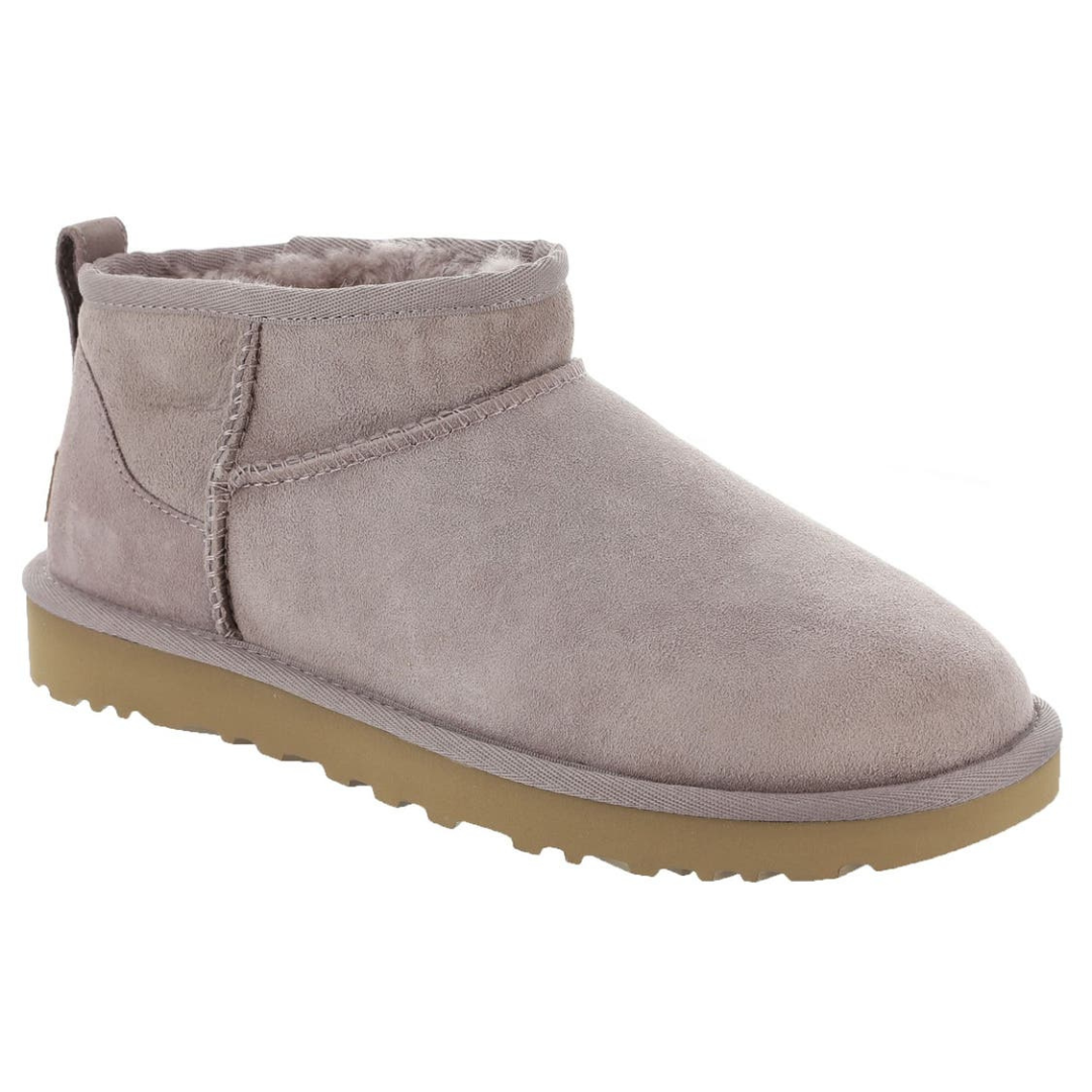 A single, gray suede ankle boot with a fur-lined interior and beige rubber sole, featuring a back pull tab and visible stitching.