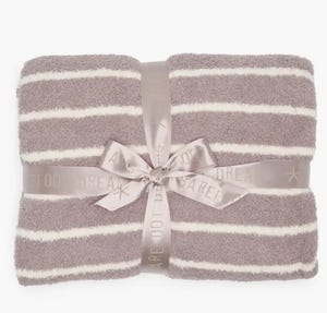 Barefoot Dreams Cozychic Striped Throw features a soft, plush design with alternating wide taupe and white stripes, tied with a satin ribbon.