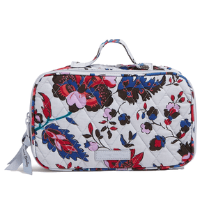 Rectangular quilted makeup case with a floral pattern in shades of blue, red, and pink. Features a top handle and a zipper closure.