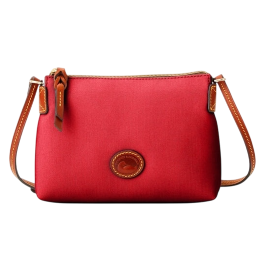 A red crossbody bag with a brown leather strap and zipper, featuring an embossed logo on the front.