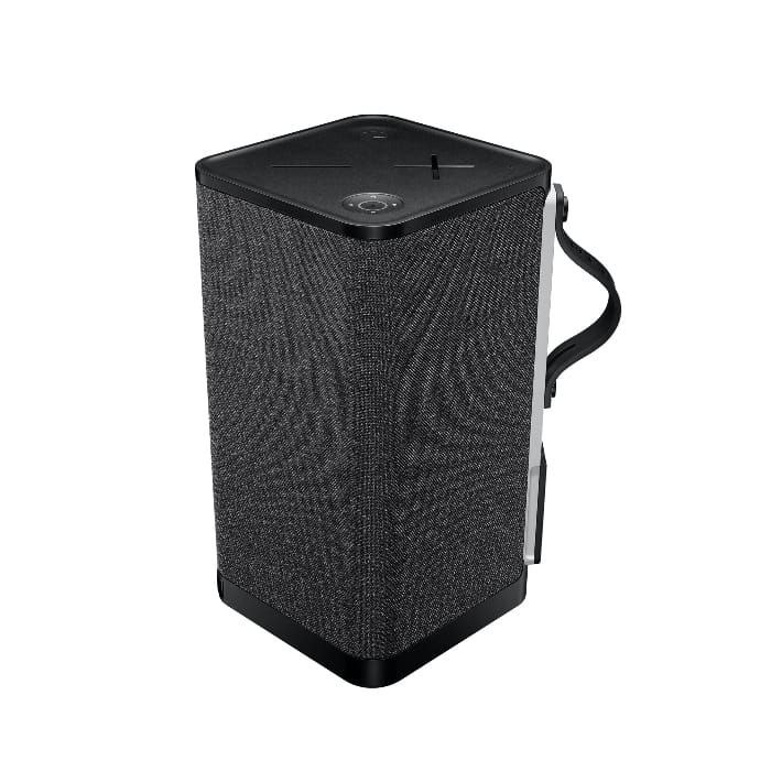A rectangular portable Bluetooth speaker with a black fabric exterior, featuring a control panel on top and a carrying handle on the side.