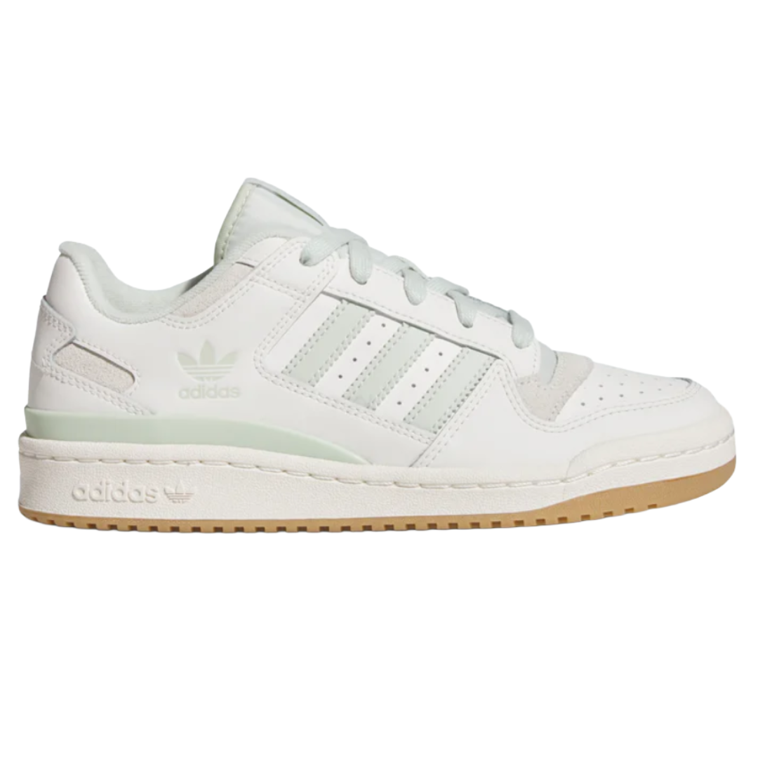Adidas sneaker in white with light green accents, featuring a classic low-top design, three stripes on the side, and a gum sole.