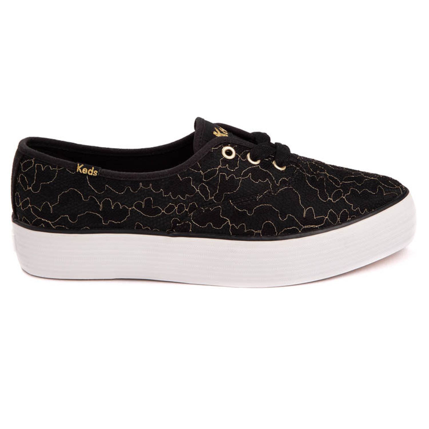 Black Keds Point Platform Sneakers feature a gold abstract line design, black laces, and gold eyelets on a white, thick rubber sole. The design offers a stylish, casual look.