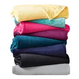 A stack of colorful plush blankets in shades of yellow, teal, pink, purple, blue, dark gray, and light gray.