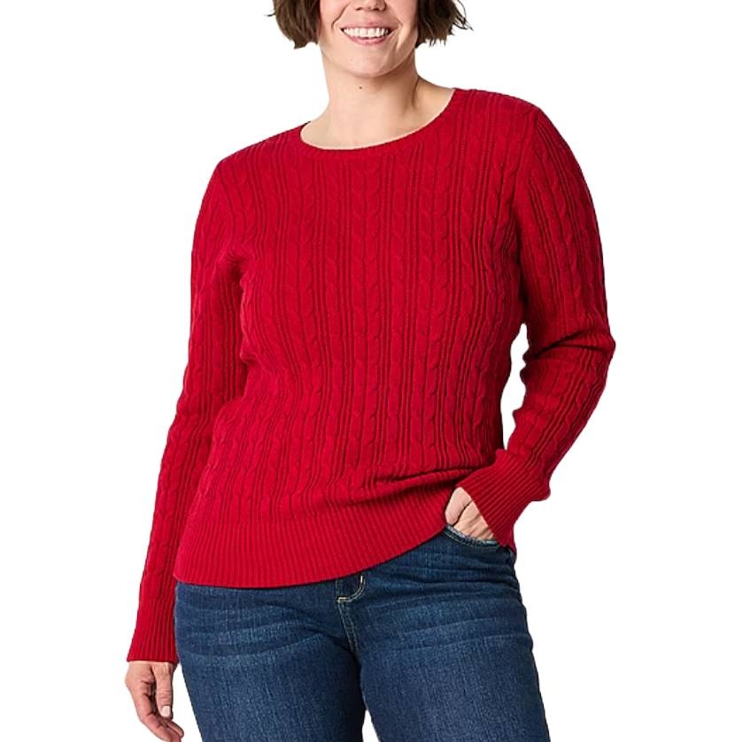 A person wearing a red cable-knit sweater paired with blue jeans.