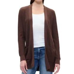 A woman is wearing a brown ribbed knit cardigan over a white tank top and jeans. The cardigan features an open front design with pockets.
