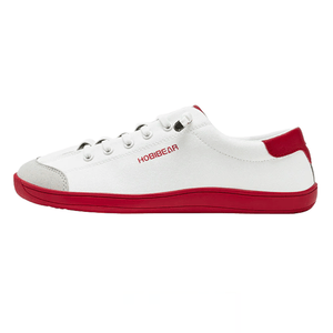 A white low-top sneaker with red detailing, featuring the brand name \“HOBIBEAR\“ on the side, a red sole, and six white eyelets for lacing.