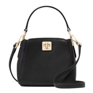 The Kate Spade Phoebe Leather Crossbody is a black leather handbag with a top handle, detachable strap, and gold-tone turn-lock closure.