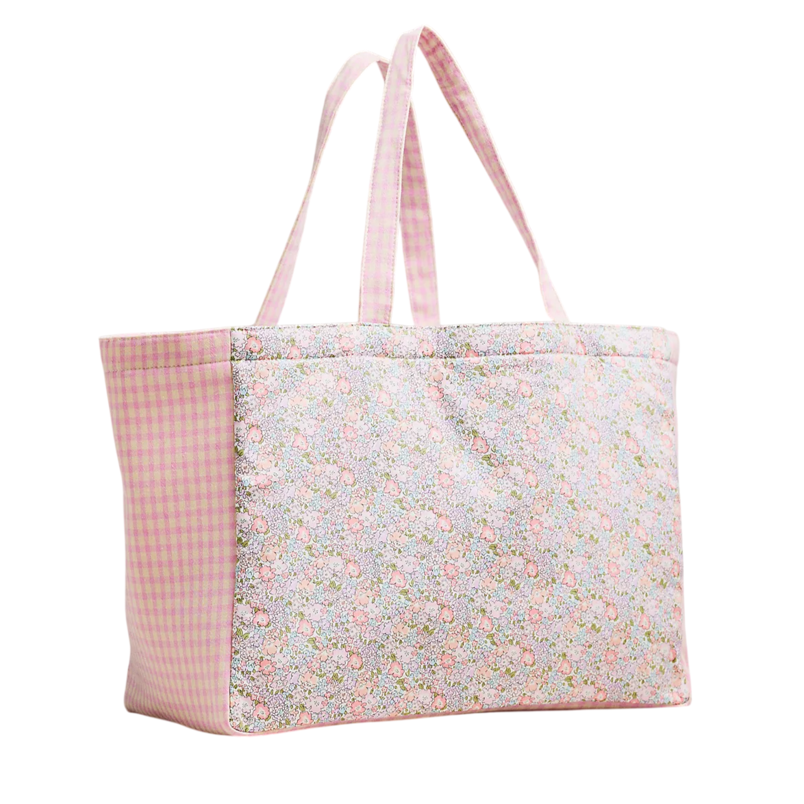 A pink tote bag with floral and checkered patterns, featuring two handles for carrying.