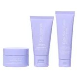 A set of three skincare products from Kate Somerville, including two tubes and one jar, labeled as Goat Milk Moisturizing Cream, designed to soothe and nourish skin, packaged in lavender-colored containers.