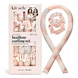 A satin curling ribbon with a scrunchie at each end and two additional hair ties, all in a pale pink color, packaged in a box with before and after photos of curled hair.