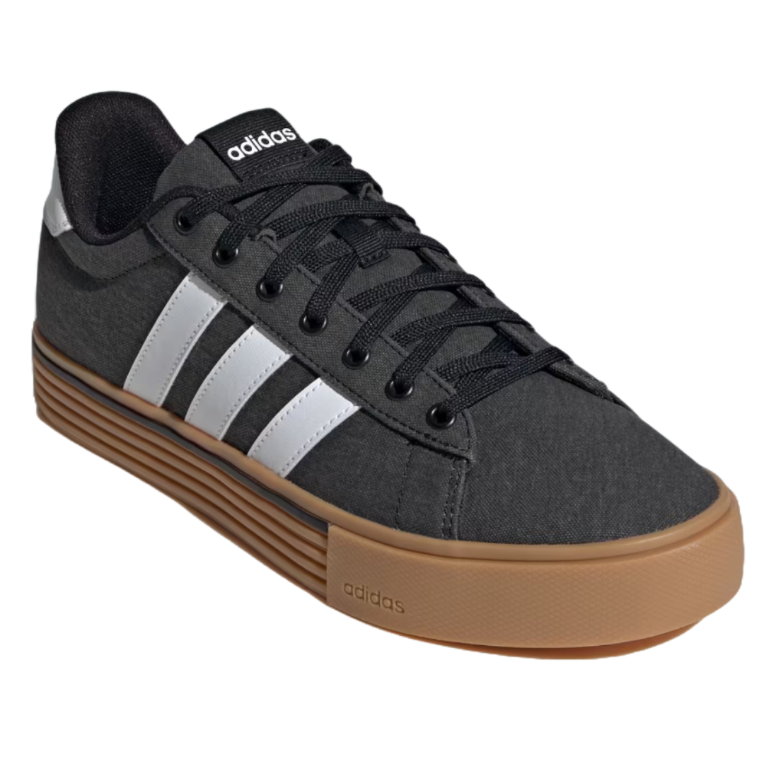 Adidas Daily 4.0 Shoes feature a black upper with white stripes, black laces, and a tan, textured rubber sole. The design is casual with a classic Adidas logo on the tongue.