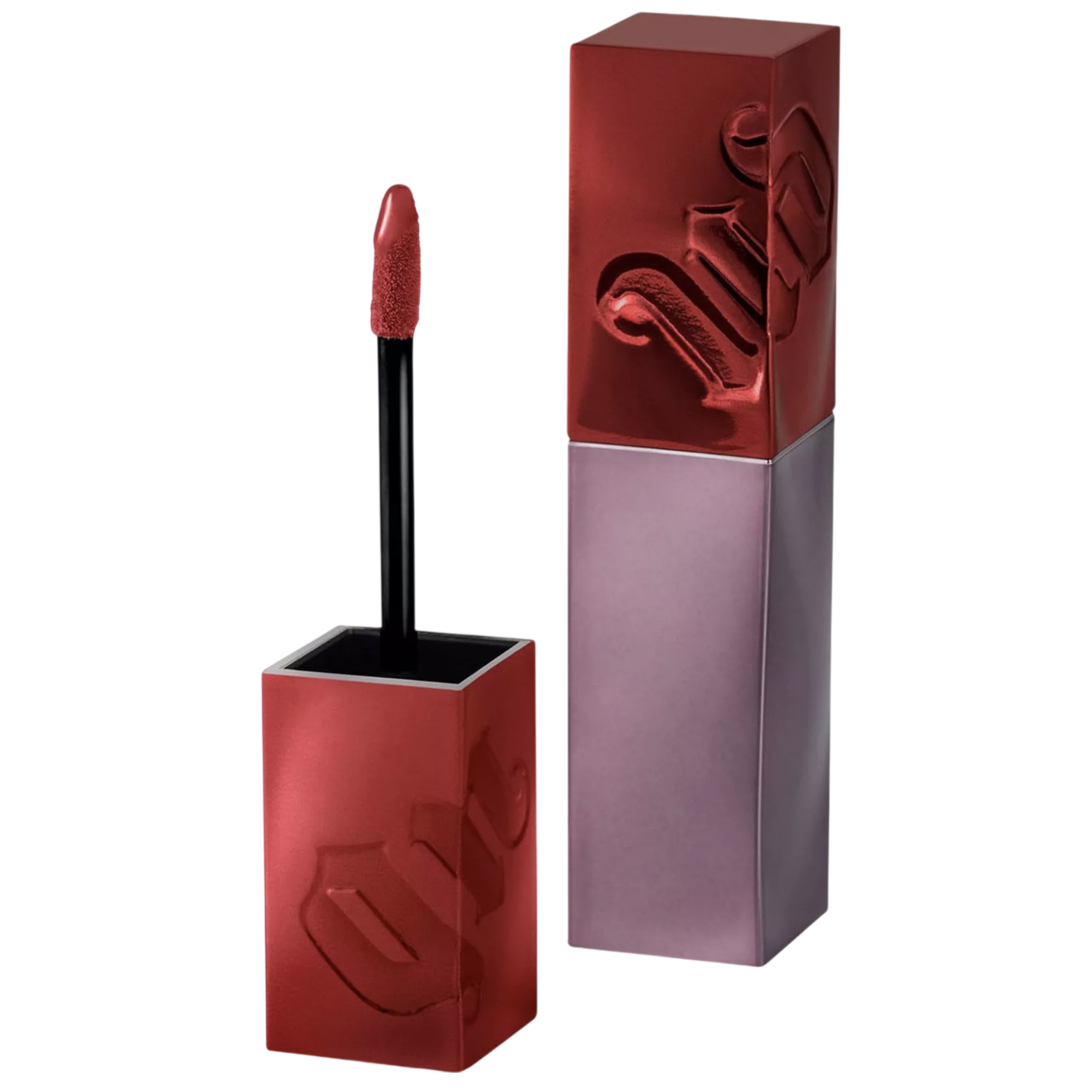 A red liquid lipstick with a square metallic cap embossed with stylized letters, featuring a wand applicator.