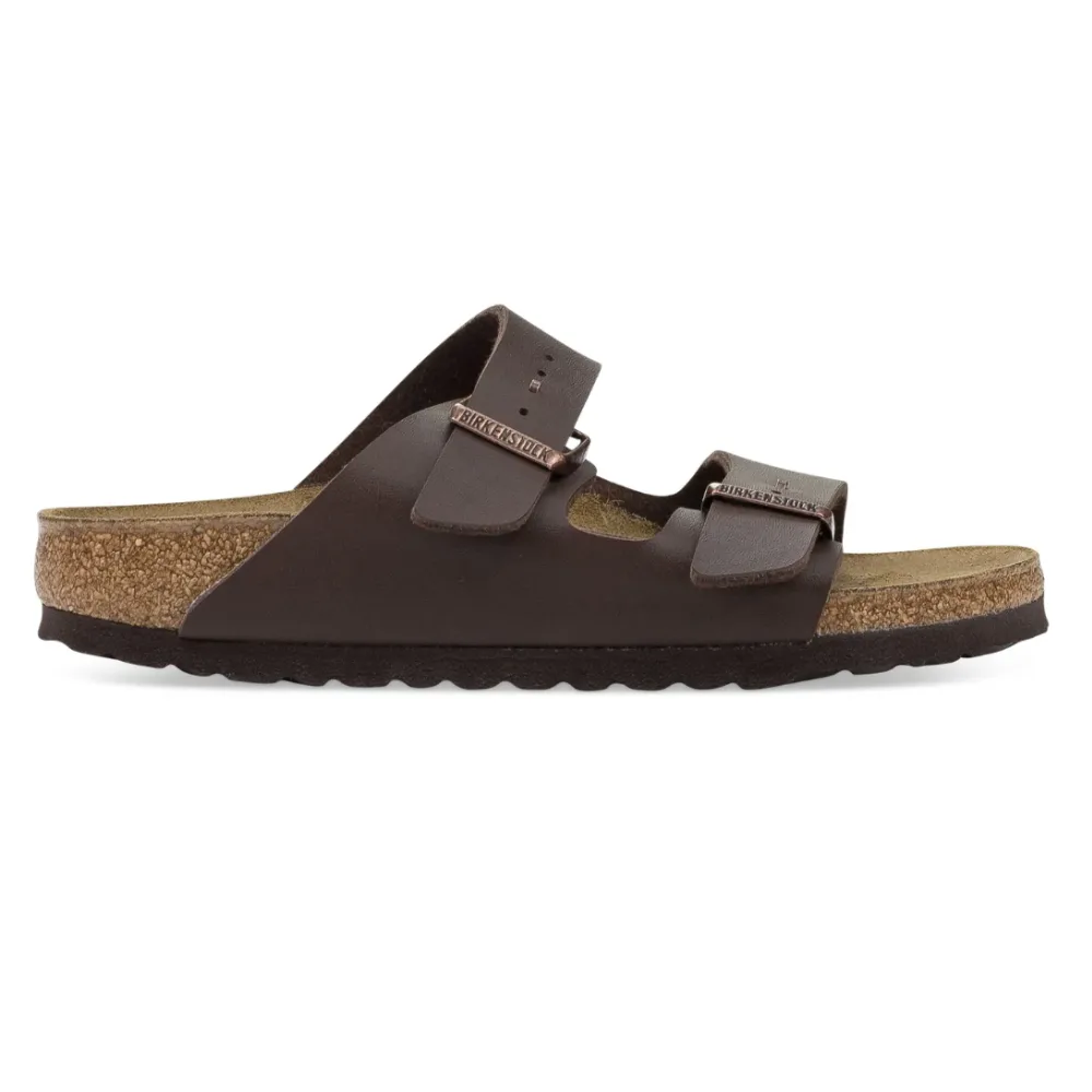 Brown Birkenstock sandal with two adjustable straps, cork footbed, and rubber sole.