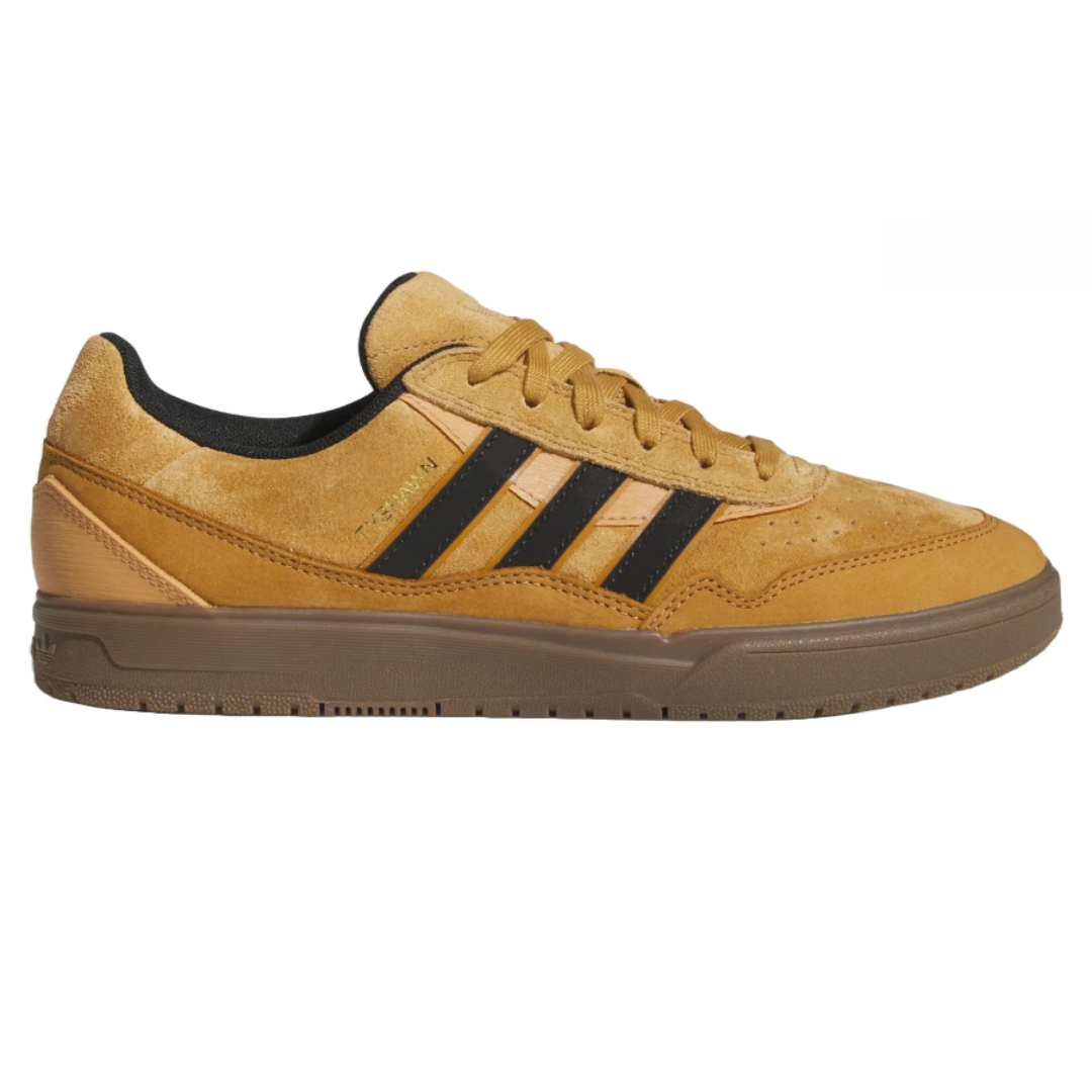 Adidas Men's Tyshawn Shoes feature a tan suede upper with black stripes, a gum sole, and a low-profile design, combining a casual look with skate-ready performance.