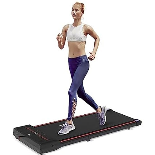 A woman is jogging on a flat, compact treadmill wearing a white sports bra, purple leggings, and athletic shoes.