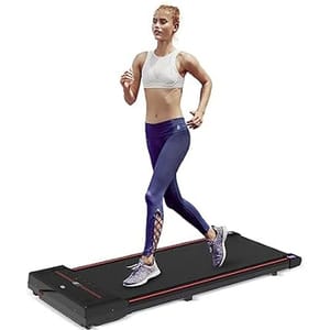 A woman is jogging on a flat, compact treadmill wearing a white sports bra, purple leggings, and athletic shoes.